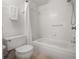 Clean white bathroom with a bathtub and shower combination and updated fixtures at 301 2Nd N St # 14, St Petersburg, FL 33701