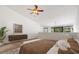 Bedroom features a ceiling fan, neutral decor, and a balcony view at 301 2Nd N St # 14, St Petersburg, FL 33701