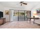 Cozy living room with ceiling fan and sliding glass doors at 301 2Nd N St # 14, St Petersburg, FL 33701