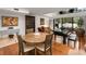 Open-concept living space with dining table, piano, and comfortable seating area at 301 2Nd N St # 14, St Petersburg, FL 33701