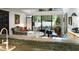 Bright living space features a piano, dining area, and seamless indoor-outdoor flow at 301 2Nd N St # 14, St Petersburg, FL 33701