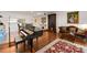 Spacious living room with a grand piano, dining area, and comfortable seating at 301 2Nd N St # 14, St Petersburg, FL 33701