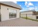 This condo features a spacious balcony with wood floors and black metal railings, perfect for outdoor living and entertaining at 3368 Ramblewood Pl # 37-D-1, Sarasota, FL 34237