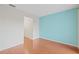 Bright bedroom featuring stylish flooring and a modern accent wall at 3368 Ramblewood Pl # 37-D-1, Sarasota, FL 34237