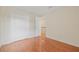 Charming bedroom with hardwood floors, closet, and natural light pouring in from the doorway is move-in ready at 3368 Ramblewood Pl # 37-D-1, Sarasota, FL 34237