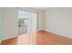 Bright bedroom with hardwood floors, a sliding glass door, and neutral walls at 3368 Ramblewood Pl # 37-D-1, Sarasota, FL 34237