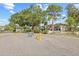 Community entrance of Ramblewood offers a landscaped sign, gated entry, and well-maintained grounds at 3368 Ramblewood Pl # 37-D-1, Sarasota, FL 34237