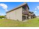 Exterior view of the property showcasing a spacious yard and private patio at 3368 Ramblewood Pl # 37-D-1, Sarasota, FL 34237