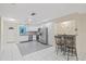 Updated kitchen with stainless steel appliances and breakfast bar with seating at 3368 Ramblewood Pl # 37-D-1, Sarasota, FL 34237