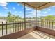 Screened-in patio with a view of a pond, bridge, and lush greenery at 3368 Ramblewood Pl # 37-D-1, Sarasota, FL 34237