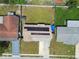Aerial view of the property with its backyard and solar panels on the roof at 3427 Cantrell St, Holiday, FL 34690