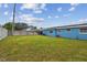 An expansive backyard with a view of the house, perfect for recreation and relaxation at 3427 Cantrell St, Holiday, FL 34690