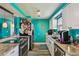 Updated kitchen with stainless steel appliances, granite countertops, and white shaker cabinets at 3427 Cantrell St, Holiday, FL 34690