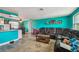 Comfortable living room featuring a large sectional, cozy rug, and open floor plan with kitchen and dining area at 3427 Cantrell St, Holiday, FL 34690
