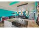 Open concept kitchen and living room with bar top overlooking a large sectional couch at 3427 Cantrell St, Holiday, FL 34690