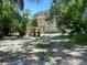 View of the backyard with partial fencing and some trees at 3518 16Th S Ave, St Petersburg, FL 33711