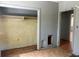 Empty bedroom with open closet and view into living room at 3518 16Th S Ave, St Petersburg, FL 33711