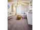 Bright Bedroom with a crib, changing table, chair, and a unique yellow sunburst design on the ceiling at 36972 Sagemoor Dr, Zephyrhills, FL 33541