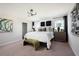 Bright bedroom with large bed, modern decor, and windows letting in natural light at 36972 Sagemoor Dr, Zephyrhills, FL 33541
