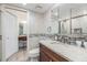 Bathroom featuring granite countertop, under mount sink, tile backsplash and white marbled tile floors at 387 S Mcmullen Booth Rd # 16, Clearwater, FL 33759
