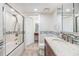 Bright bathroom featuring tiled bathtub and shower, with granite vanity and tiled floors and backsplash at 387 S Mcmullen Booth Rd # 16, Clearwater, FL 33759
