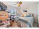 Bright bedroom featuring two twin beds with blue accents and plenty of natural light at 387 S Mcmullen Booth Rd # 16, Clearwater, FL 33759