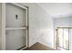 Condo entryway with a security door and textured walls, providing security and privacy at 387 S Mcmullen Booth Rd # 16, Clearwater, FL 33759