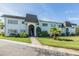 Two-story condo complex with lush landscaping and a well-manicured lawn at 387 S Mcmullen Booth Rd # 16, Clearwater, FL 33759