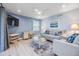 Bright living room with a desk area, beach decor and open layout at 387 S Mcmullen Booth Rd # 16, Clearwater, FL 33759