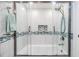 Bright and clean bathroom featuring a stand up shower with glass doors and tiled walls at 387 S Mcmullen Booth Rd # 16, Clearwater, FL 33759