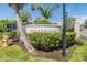 Well-maintained community sign surrounded by manicured landscaping, providing a welcoming entrance at 387 S Mcmullen Booth Rd # 16, Clearwater, FL 33759