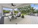 Relaxing balcony seating area with neutral decor, outdoor ceiling fan, and covered space at 4604 W Euclid Ave, Tampa, FL 33629