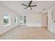 Spacious bedroom with light colored floors, and french doors leading to a outdoor balcony at 4604 W Euclid Ave, Tampa, FL 33629