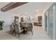 Modern dining room and kitchen featuring stainless steel appliances and stylish two-tone cabinetry at 4604 W Euclid Ave, Tampa, FL 33629