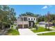 Stunning two-story home featuring a modern design with a two-car garage and a charming second-floor balcony at 4604 W Euclid Ave, Tampa, FL 33629