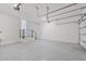 Spacious garage offers epoxy flooring and a staircase to the main living area at 4604 W Euclid Ave, Tampa, FL 33629