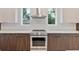 Modern kitchen with stainless steel appliances and custom wood cabinets at 4604 W Euclid Ave, Tampa, FL 33629