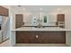 This kitchen features a large island, stainless steel appliances, and stylish cabinetry at 4604 W Euclid Ave, Tampa, FL 33629