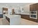 Modern kitchen features stainless steel appliances, custom cabinetry, and a large center island with a sink at 4604 W Euclid Ave, Tampa, FL 33629
