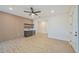 Bright living room with wet bar, shelving, and modern wood-look plank flooring at 4604 W Euclid Ave, Tampa, FL 33629