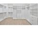 Bright walk-in closet with custom shelving, drawers, and ample storage space at 4604 W Euclid Ave, Tampa, FL 33629