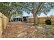 Spacious backyard featuring mature trees, a wooden fence, and ample space for outdoor activities at 501 74Th N Ave, St Petersburg, FL 33702