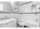 This bathroom has white subway tile in the shower and a granite countertop on the vanity at 501 74Th N Ave, St Petersburg, FL 33702