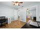 A bedroom with space for a desk and storage with a view into another living space at 501 74Th N Ave, St Petersburg, FL 33702