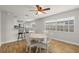 Dining area showcases a kitchen pass-through, a table for four, and natural light at 501 74Th N Ave, St Petersburg, FL 33702