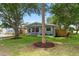 Charming single-story home with a well-manicured lawn, mature trees, and inviting curb appeal at 501 74Th N Ave, St Petersburg, FL 33702