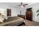 Spacious bedroom with ceiling fan, ensuite bath, and walk-in closet at 507 S Willow Ave, Tampa, FL 33606