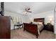 Cozy bedroom with neutral decor, ample natural light, and dark wood furniture at 507 S Willow Ave, Tampa, FL 33606