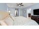 Bright bedroom features a ceiling fan, ample closet space and ensuite bath at 507 S Willow Ave, Tampa, FL 33606
