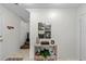 Light and bright entryway with decorative shelving and artwork at 507 S Willow Ave, Tampa, FL 33606